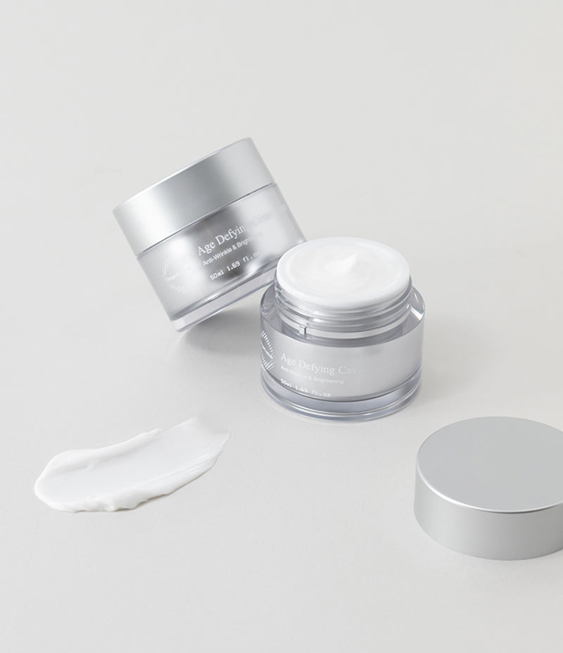 High-end Age Defying Caviar Cream tubs and a sample swatch presented for anti-aging care.