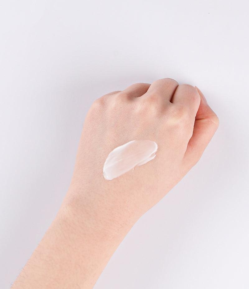  Close-up view of the rich cream texture of Anti Oxidant Cream applied to the back of a hand
