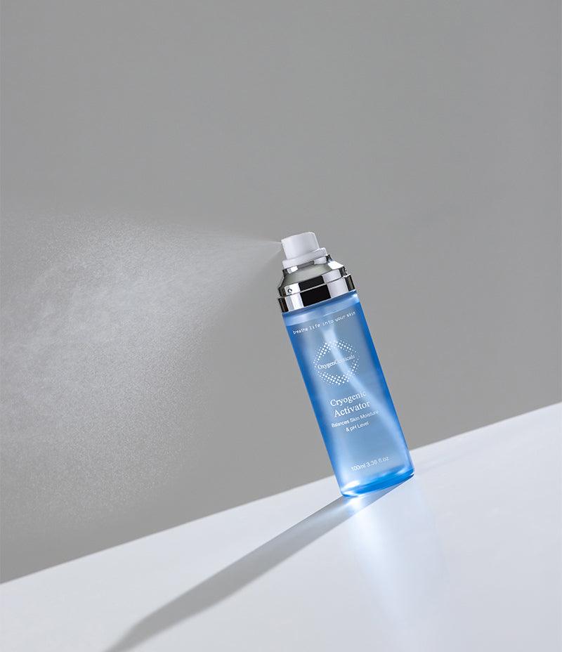 Blue bottle of Cryogenic Activator, an all-natural face mist and toner with deep-sea water and pure O2, on white surface.