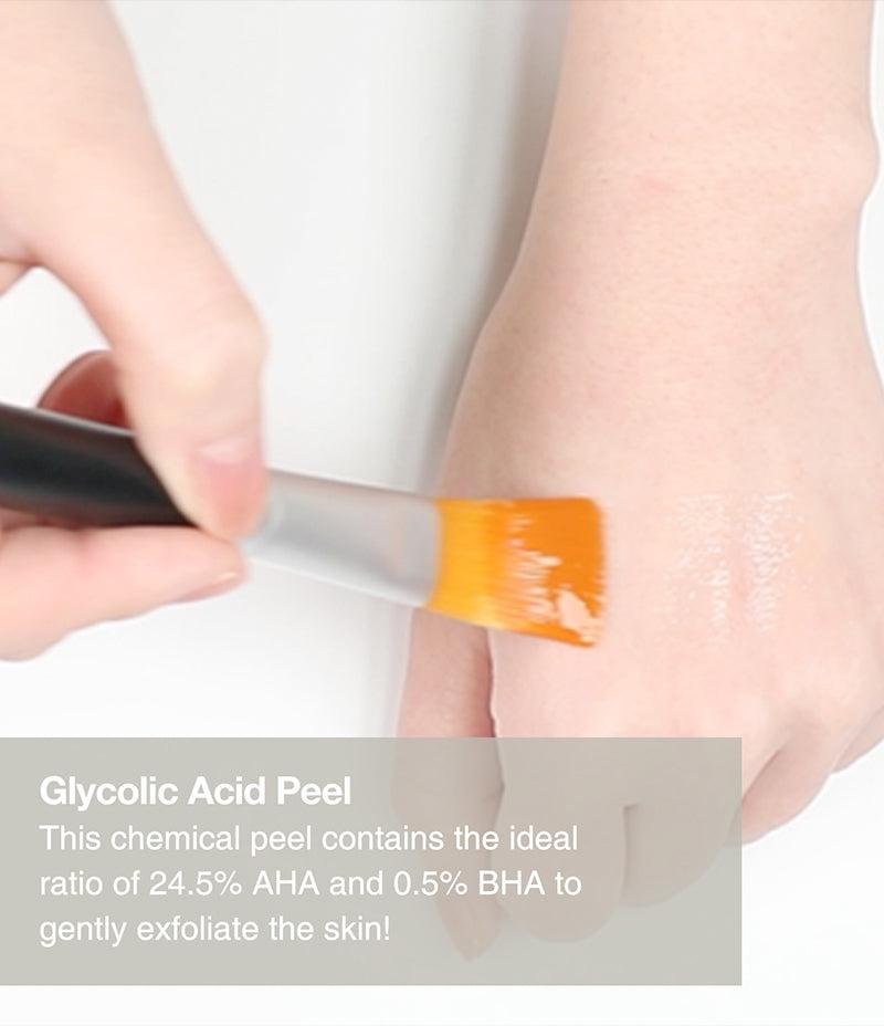 Person applying the Double Peel to the back of hand with a brush. Caption reads: Glycolic Acid Peel, this chemical peel contains the ideal ratio of 24.5% AHA and 0.5% BHA.