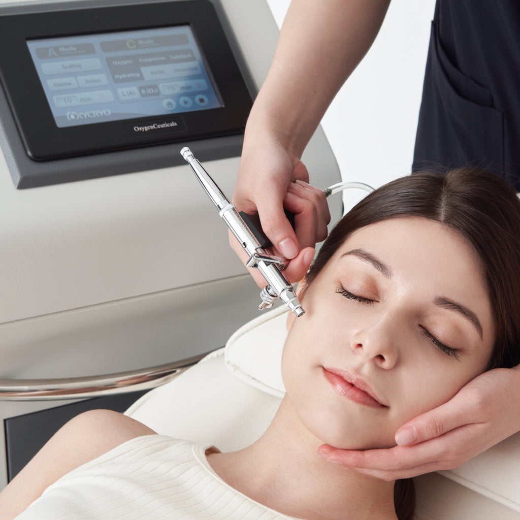 Woman enjoying a refreshing oxygen therapy hydrafacial treatment with OxygenCeuticals OXYCRYO.