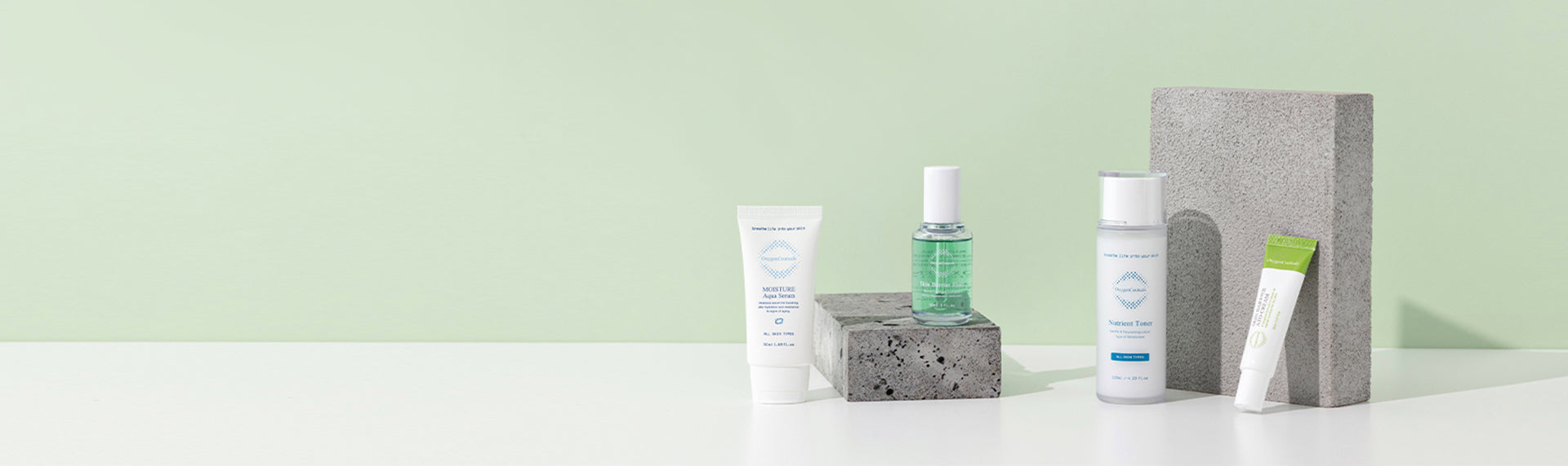 Best Korean skincare brand, OxygenCeuticals, showcasing their firming line on a soothing pale green backdrop.