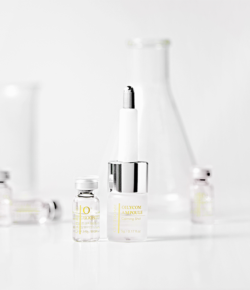 Two top-notch soothing care products, Ceutisome Oilycom Ampoule and O-Booster beautifully presented in front of a sleek, silver background.