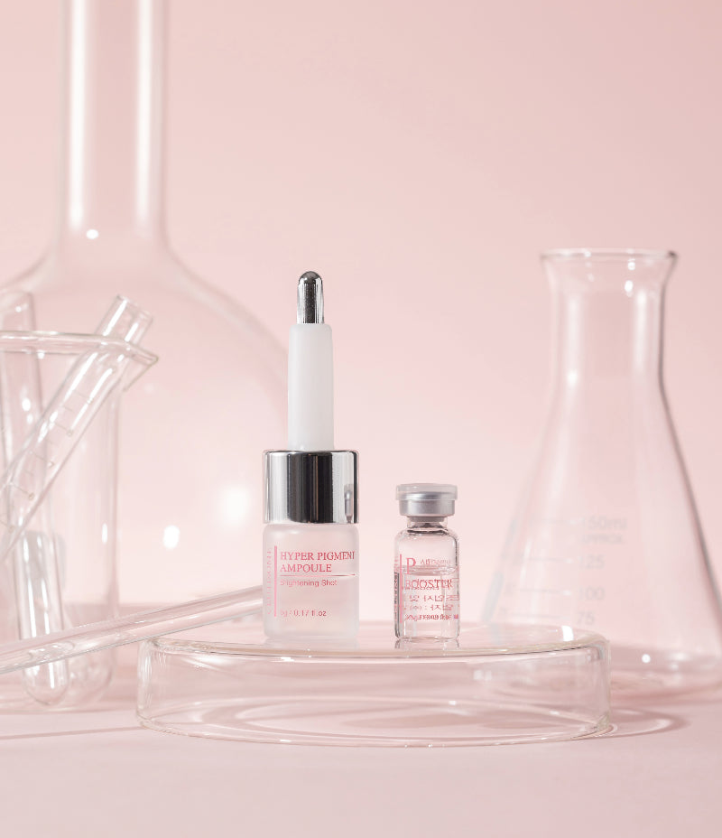 Get a clear complexion with the Ceutisome Hyper Pigment Ampoule and P-Booster, displayed on a glossy, pink background.