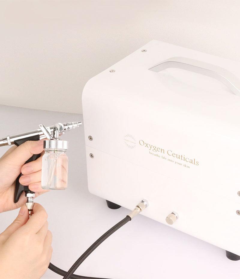 OxygenCeuticals OZ Portable with Oxygen Spray Gun and Ampoule Cup.   Used for Oxygen facial. Can be used with masker oxygen, oxygen mask, oxygen serum, oxygen skincare, what is a misting device used for facial treatments, image oxygen facial.