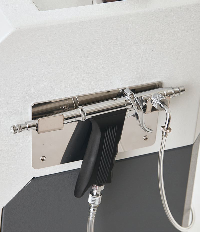 Oxygen spray gun attached to the back of the AstrodomeFacial for Oxygen Therapy Treatment