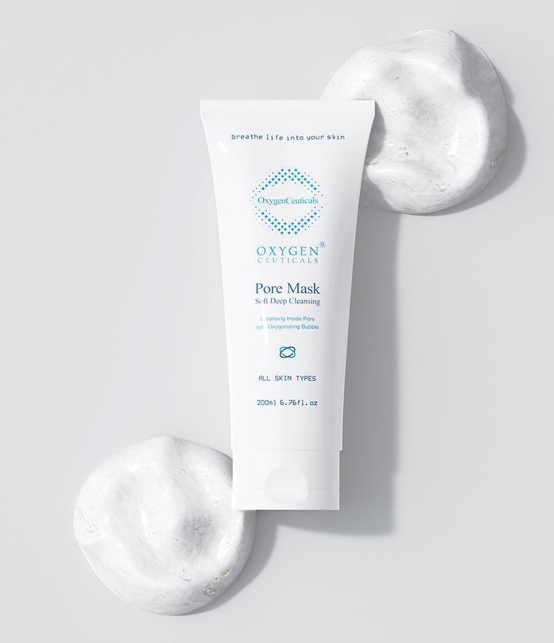  A white surface showcasing the OxygenCeuticals' Pore Mask tube, a top-selling foaming cleanser enriched with pure oxygen.