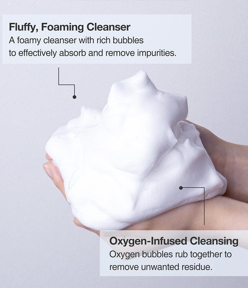 Person holding a pile of thick Pore Mask foam with key information of the Pore Mask, a fluffy, oxygen-Infused foaming cleanser