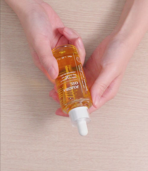 Brief video of  a person applying the Jojoba Oil to their fingernails for cuticle health.